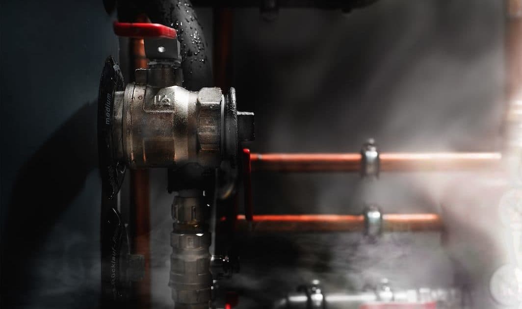 Steam coming out of a boiler's pipes.