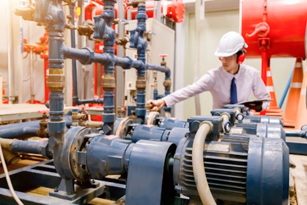 Guy checking industrial chiller system