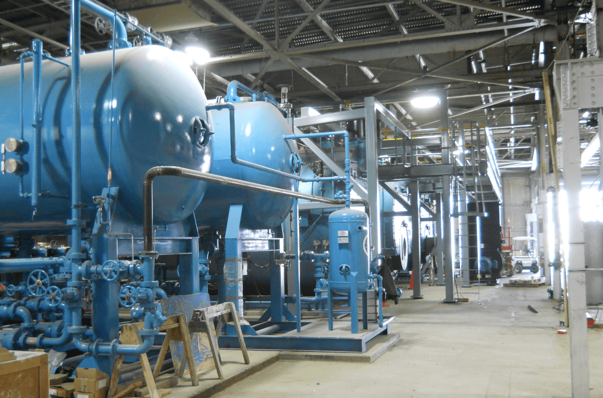 Close up of two deaerator systems connected to cleaver brooks boilers.