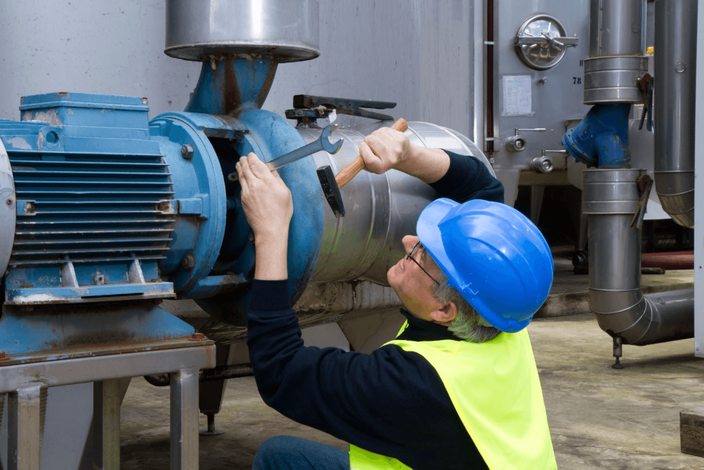 Facility Manager performing centrifugal pump maintenance.
