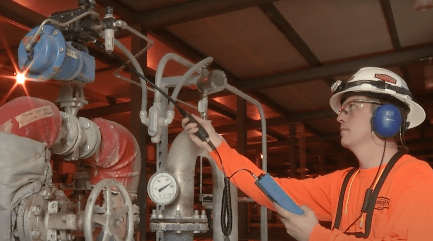 Ultrasonic leak detection being used in an industrial plant.