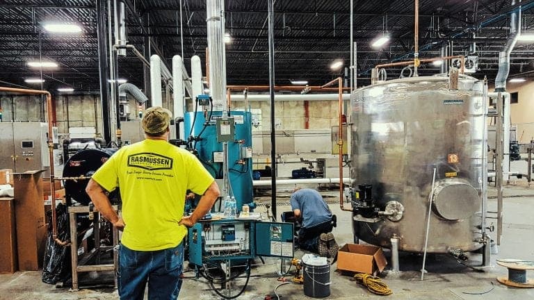 Technician with hands on hips