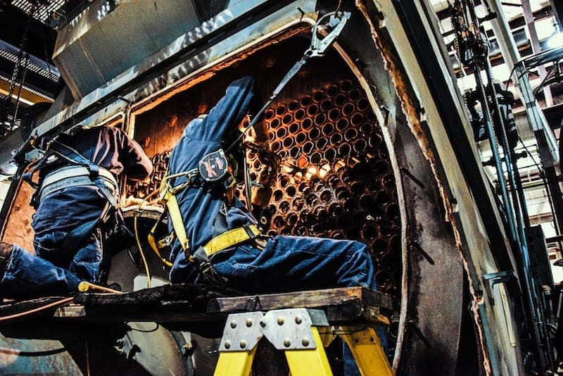 A man working on boiler repair.