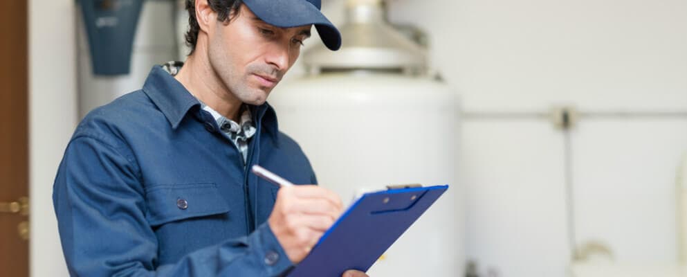 Technician using a maintenance checklist to keep track of maintenance tasks.