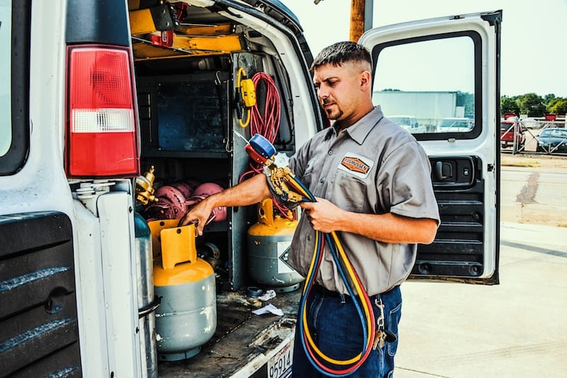 HVAC system cost | Rasmussen Mechanical Series Industrial and Commercial HVAC Service Tech
