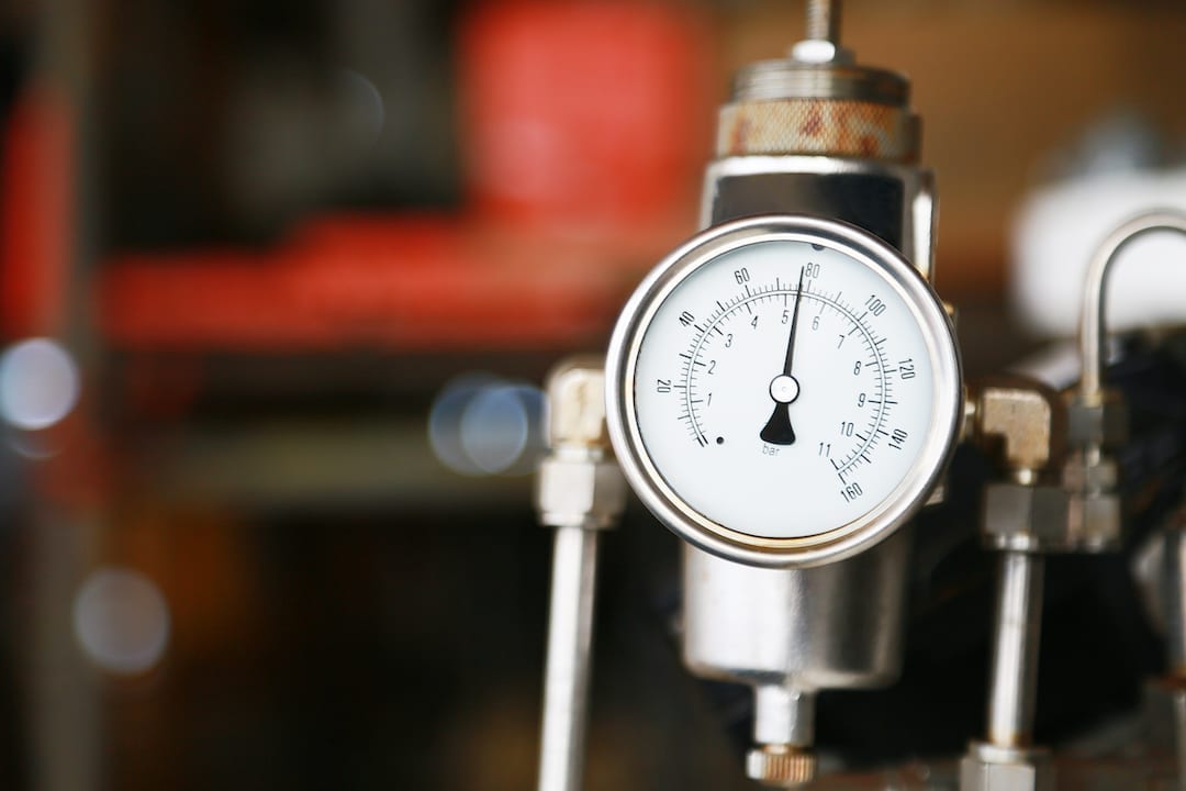 An industrial air compressor pressure thermometer.