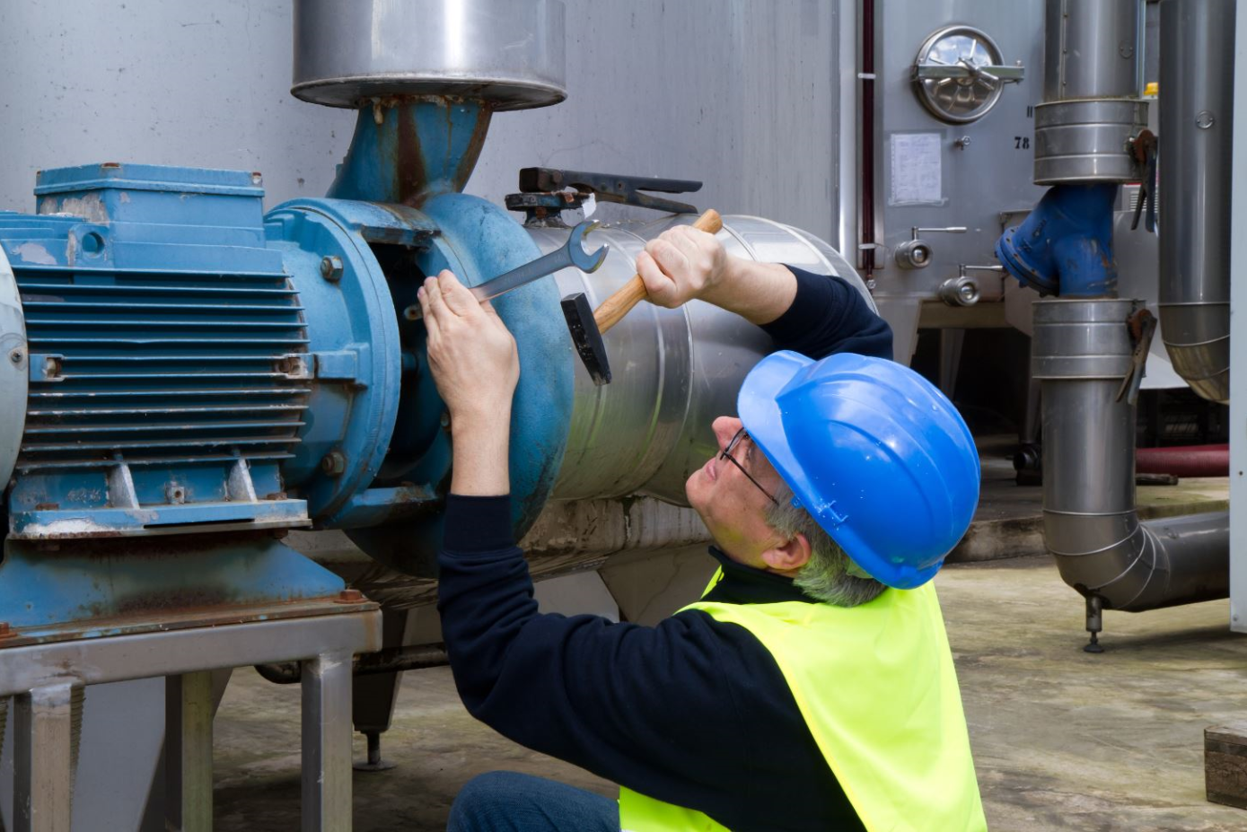 Facility Manager performing centrifugal pump maintenance.