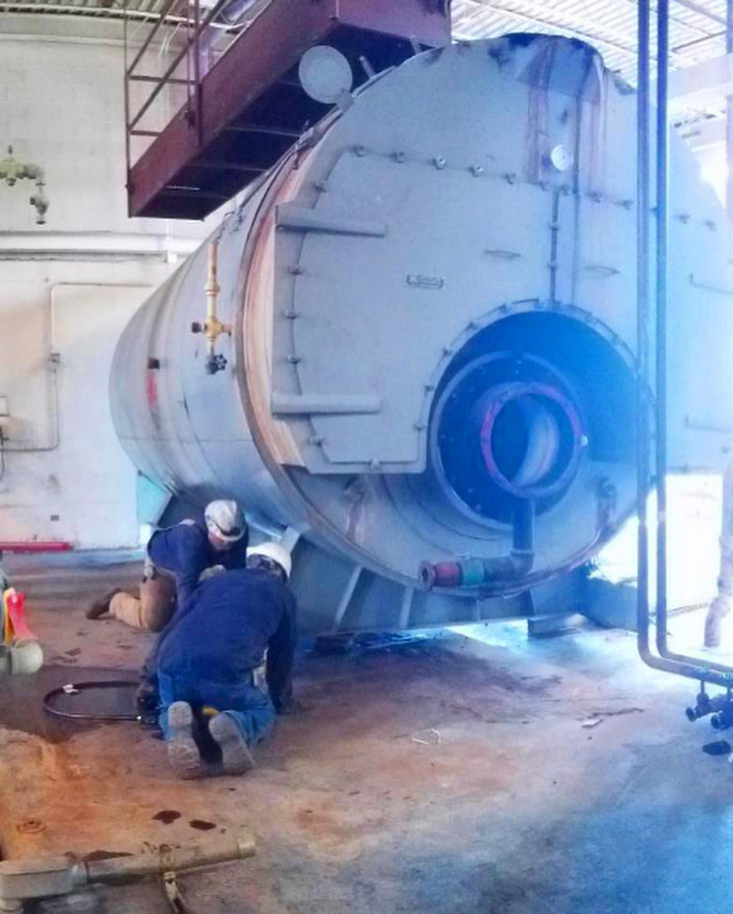 Technicians removing old kewanee boiler